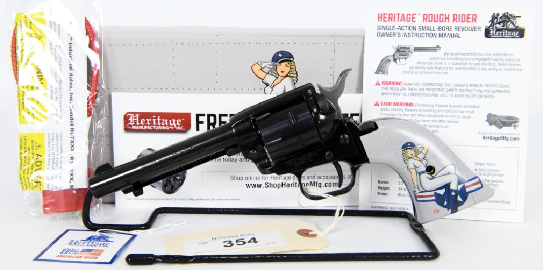 Heritage Rough Rider 22LR 4" Lady Luck Pinup TALO: NEW in the box is a super cool Heritage Rough Rider "Lady Luck" Pinup 1 Grips gray in color chambered in the .22 cal (no mag cylinder in this box) comes with lock and manual: RR22B4 .22 LR black with