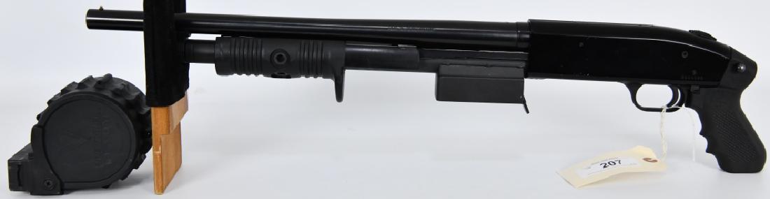 Mossberg 500A 12 Gauge Pump Action Shotgun: Here is a Tactical model Mossberg 500A Pump Action Tactical Pistol Grip Shotgun with a sidewinder venom drum. Has a barrel that measures approx 18.5" in length, has a front bead sight, overall length 