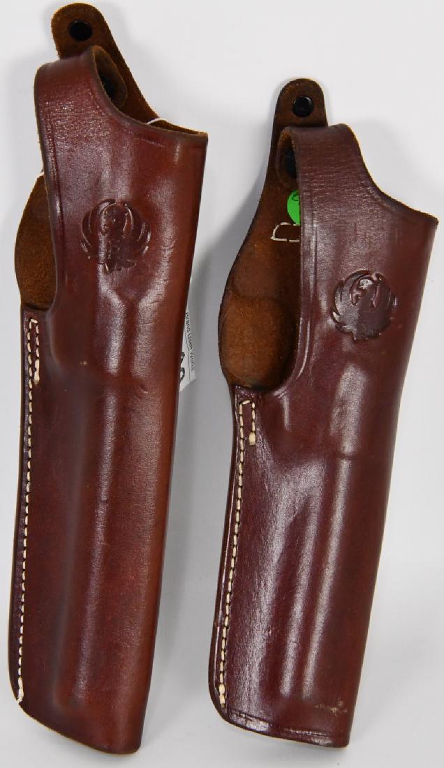Lot of two Leather Pistol Holsters: Ruger 196-28 6 7/8 Ruger 196-28 5 1/2 Bother are in excellent condition with heavy stitching and belt loop for up to 3" wide belts Ruger emblem on the snaps, get your bid on and catch a great deal!