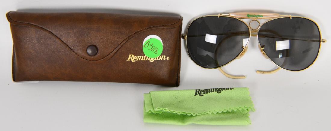VTG Remington Aviator Style Shooting Glasses W/cas: Vintage Remington Aviator Style Shooting Glasses Gold Frame w/ Case Sunglasses and wipe towl with Remington Name. The brown lined case shows Remington on the front, gold color frame with ear piece