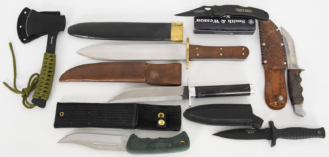 ASSORTMENT OF SIX KNIVES AND A HATCHET: 1) Very large 9.5-inch blade fighting knife, with riveted wooden scales and brass guard. It is marked “India” and comes with original leather and brass sheath. 2) Another larger bowie-style knife 