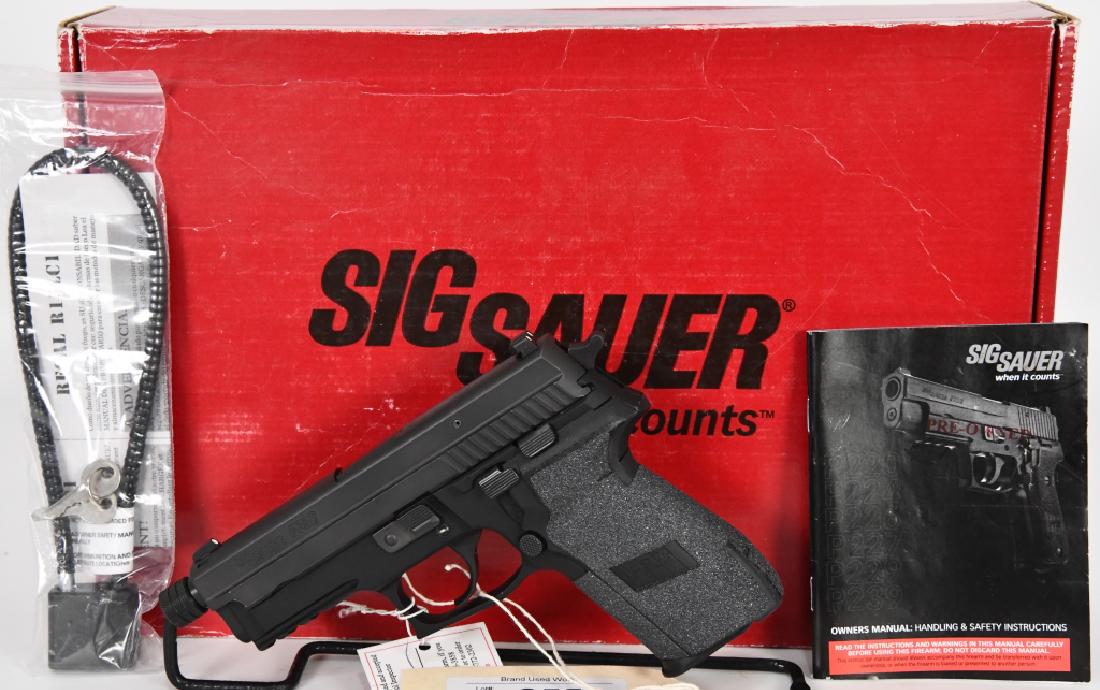 Sig Sauer P229 Semi Auto Pistol 9MM Threaded Bar.: Here is one of our top choices for a pistol this auction, Here is a Very nice and clean, marked by Sig "pre owned" Pistol chambered in 9MM and comes with 1 magazine, in the factory box with lock and p