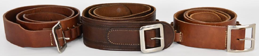 THREE LEATHER CARTRIDGE BELTS: THREE LEATHER CARTRIDGE BELTS: The first is a 42-inch high-quality belt marked “R. M. Bachman, Kalispell, Montana” and has 32 loops which hold .38 Special or similar-sized cartridges. Second is ap