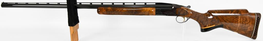 Browning BT-99 Trap Shotgun 12 Gauge: Up next we have a Browning BT-99 Trap Shotgun Chambered in 12 Gauge, fixed modified choke, Adjustable Comb, The vent rib barrel measures 32" with front and mid bead sights. The Bore is bright and shin