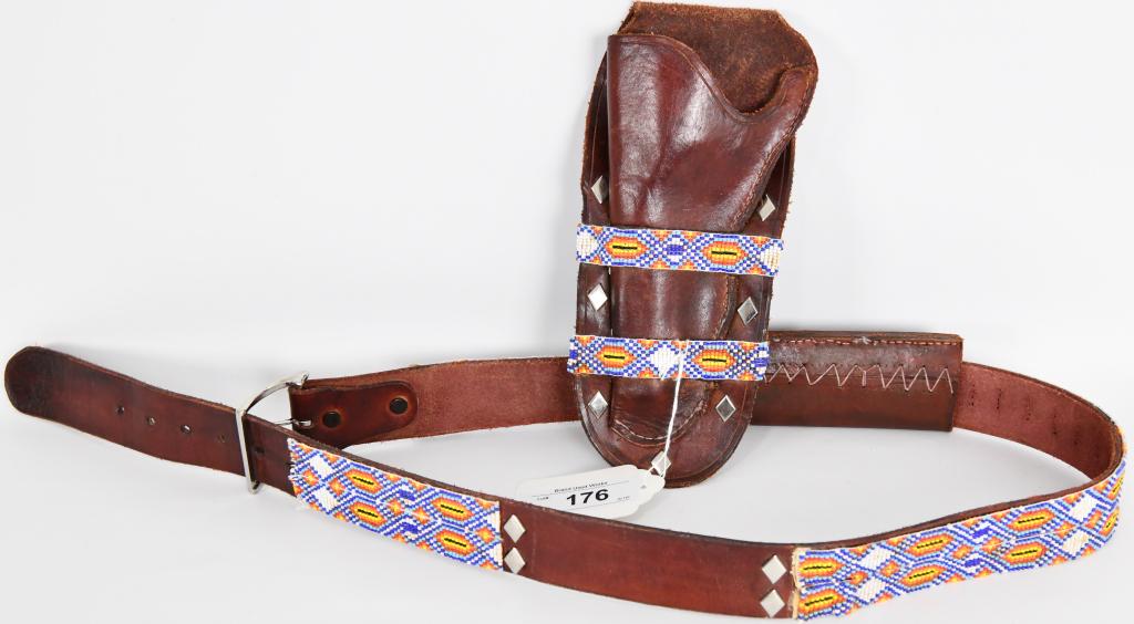 Leather Beaded Ammo / Holster Belt Native Style: Leather Beaded Ammo / Holster Belt Native style unbranded, belt measures approx 48.5" end to end and a 1.75" width, the holster measures approx 11" from top to bottom by 5" at the widest point, the am