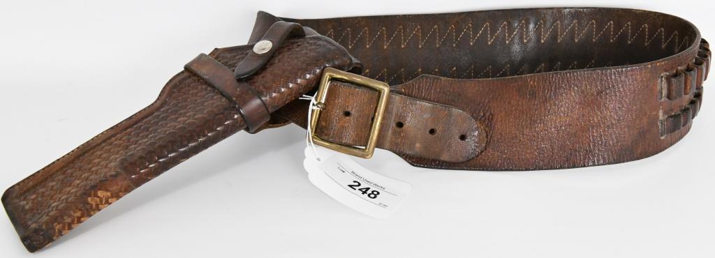 The George Lawrence Co Leather Holster ammo Belt: #25B M T 6 measures approx 40" long approx 3" at the widest point, holds approx 30 rounds of two sizes of ammo and the basket weaved holster is approx 10" in length, the basket weaved Holster is appro