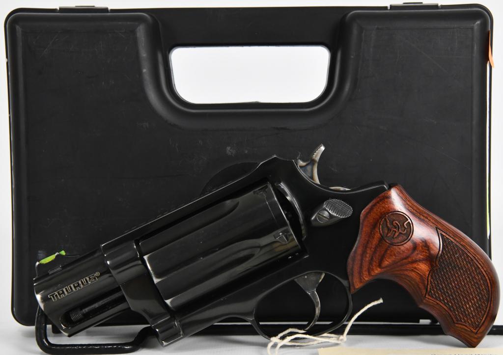 Taurus Public Defender .410 / .45 LC Revolver: Up Next We have a Taurus Public Defender Revolver. It's Chambered in .45 Colt / .410 Gauge and features a compact design with a 2" blue steel barrel, a blue steel cylinder and Wood grips. The revolver