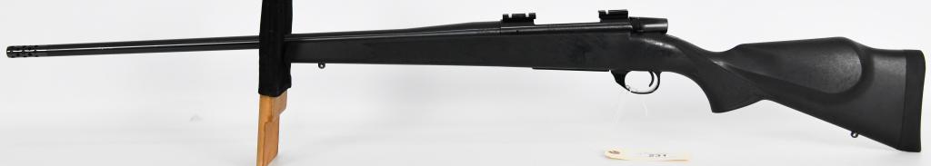 Weatherby Vanguard .300 Weatherby Magnum Rifle: Up Next We Have a Weatherby Vanguard Bolt Action Rifle Chambered in .300 Weatherby Magnum, Black Synthetic Monte Carlo Stock, Equipped With a Muzzle Brake, and Topped With Scope Mount Two Piece Rails.