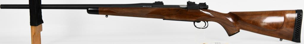 Built Mauser .300 Remington Ultra Magnum Rifle: Up Next is a Tastefully Built Mauser Action Bolt Action Rifle Chambered for .300 Remington Ultra Magnum. 24" Fluted Barrel, Nice Monte Carlo Hardwood Stock, Oversized Bolt Handle, Drilled and Tapped a
