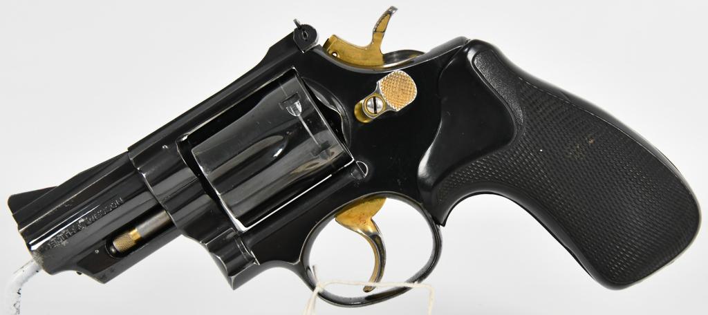 Smith & Wesson Model 19-3 .357 Mag Revolver: Up Next is a Smith & Wesson Model 19-3 Six Shot Revolver Chambered in .357 Magnum, It is adorned with Gold Plated Trigger, Hammer, Thumbpiece, and Extractor Rod Tip. Setup With Pachmayr Presentation C