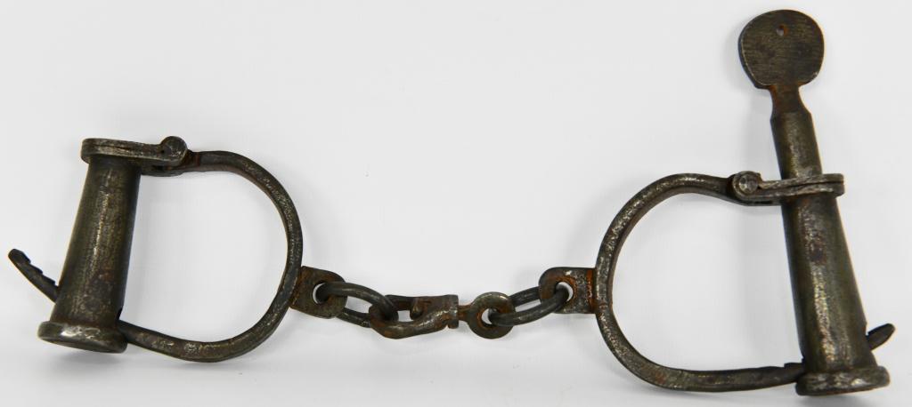 Darby "D" Shackles Wrist Ankle Shackles: Darby "D" Shackles Wrist Ankle Shackles With Original Key Has #23 On It Pair of Darby shackles, also known as “D” shackles. They are adjustable for various size wrists. Based on the length between