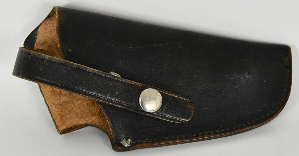G.C.Co. Black Leather Holster S&W 4" or Colt offic: This lot contains a G.C.Co H25, Belt loop held, Black and Beige leather holster: shows stamping on backside of 4" S&W Military & Police or Colt Official Police .38 special Marshall, stamped made in Ge