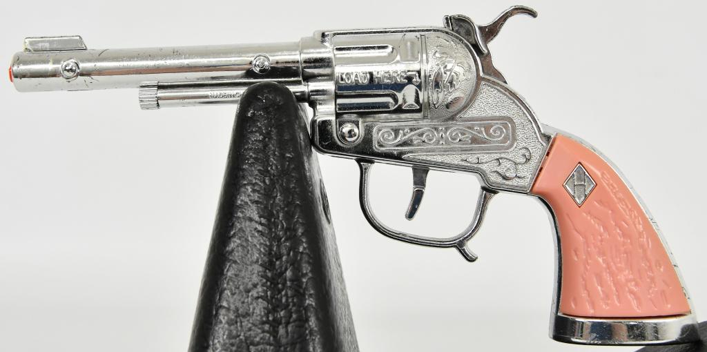 Die Cast Pink Revolver Cap Gun: Die Cast Pink Revolver Cap Gun Measures 8" Long Overall Has Pink Hand Grips Overall In Good Condition