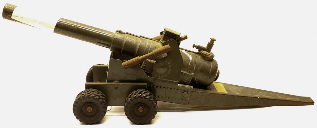 25" Big Bang L 155mm Military Style Mini Canon: Vintage 1958 design. Mounted on eight heavy duty rubber tractor wheels. Simulated hydraulic lifter. Features automatic charger mechanism for rapid, multiple firing.