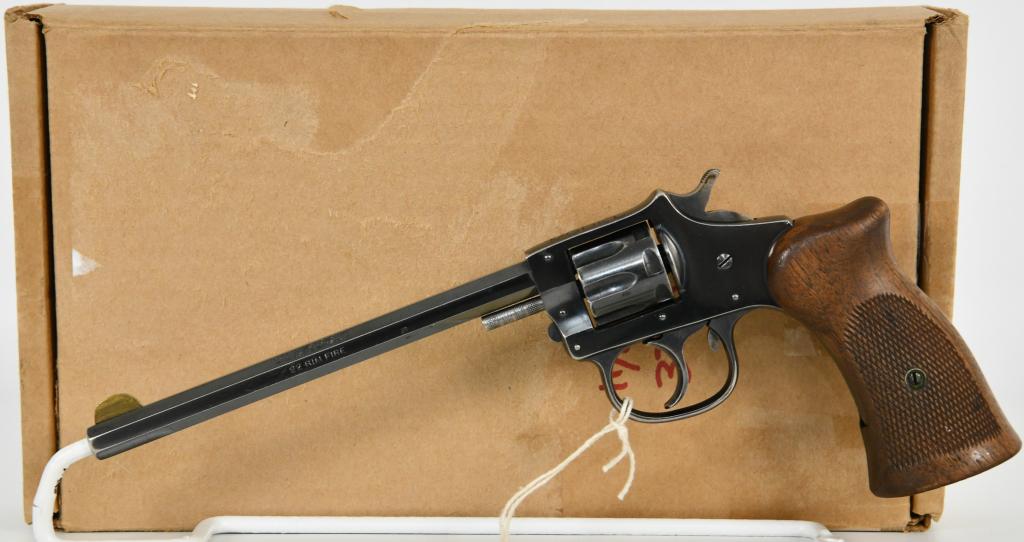 H&R Trapper Model .22 Rim Fire Revolver: Here we have a Harrington & Richardson Trapper Model Revolver, Chambered in .22 LR With a Seven Shot Cylinder, 6" Hex Barrel, Original Wood Grips, Half Moon Front Sight, Notched Rear Sights. and Overa