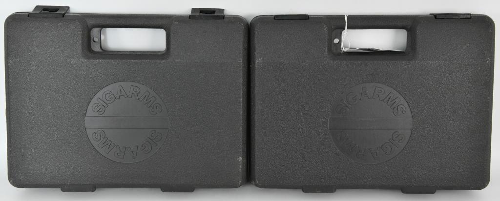 Lot of 2 Hand Gun Hardcases by Sig Arms: Lot of 2 hardcases by Sig Arms, for your handgun of choice these measure approx 13" x 9" on the wide side, there is pre cut foam on the interior, overall in real nice condition, heavy duty molded thic