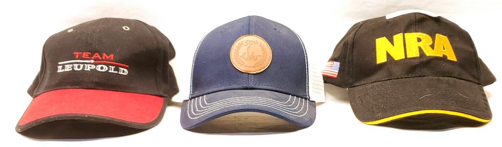 Lot Of 3 New Various Adjustable Hats: This Lot Includes , 1 Leupold Team Red & Black Hat, 1 50th Smith & Wesson Blue & White Hat, & 1 NRA Black & Gold Hat , All Hats Are One Size Fits All