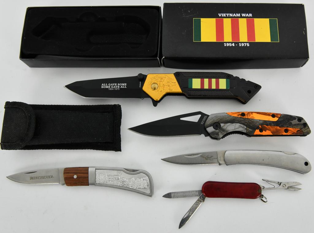Lot of 5 Pocket Folding Knives: Vietnam War Foldin: 1-Vietnam War Folding knife "All Gave Some Some Gave All" 1954-1975 comes with a blade that measures approx 3.5" Dual knob opener, pocket clip comes with box 1-Winchester single blade folding knife ap