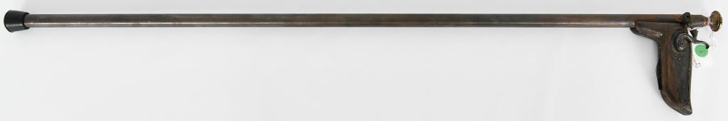 RARE!!Antique Percussion Gun Dog Cane: Here is a great collectible item for your bidding fun! W. M Moore & CO Percussion Gun Dog Cane- has a wood handle made into a dogs head, the trigger is under the handle (face) which show as a tongue, 