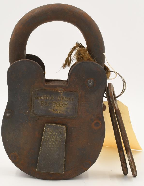 Smith & Wesson Factory Sturdy Heavy Duty Iron: Padlock ; Lock Brass Tag 2 Keys, weight is approx 4.4 pounds and measures approx 7.5" high x 4.25" wide and 1.5" thick, have fun researching this lock, may just be a reproduction, you make the determi