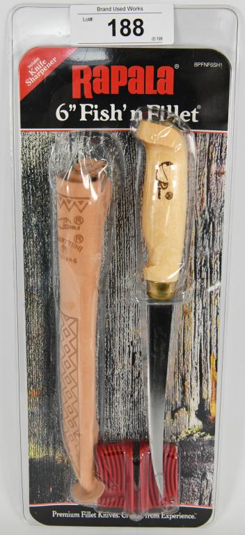 New In Package Rapala 6" Fish'n Fillet Knife Set: New In Package Rapala 6" Fish'n Fillet Knife Set, Birch Handle Class Handle Styling Tooled Genuine Leather Sheath With Belt Loop, New In Package Also Comes With Knife Sharpener