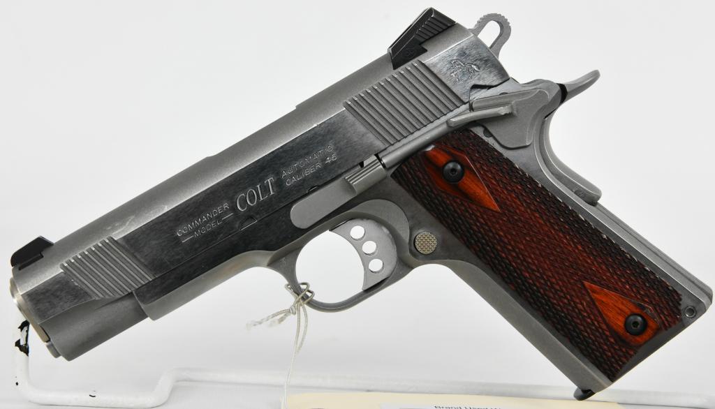 COLT COMBAT COMMANDER 1911 SEMI AUTO .45 ACP: Up Next We Have a Nice Colt Combat Commander 1911 Semi Auto Pistol Chambered in .45 ACP, Equipped With Checkered Rosewood Grips, Skeletonized Hammer and Trigger, Comes With One Magazine, Dates to 2009