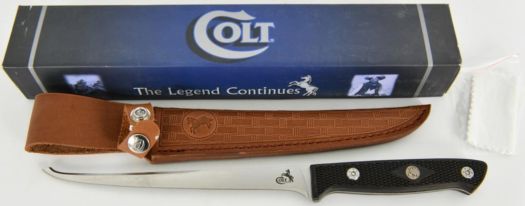 Colt Fillet knife with Leather Sheath and box: Colt Fillet knives CT229; Colt Fillet. 12 3/8 overall. 7 1/2" stainless flexible fillet blade. Full tang. Brown checkered wood handles. Brown basketweave leather belt sheath. appears to be in super ni