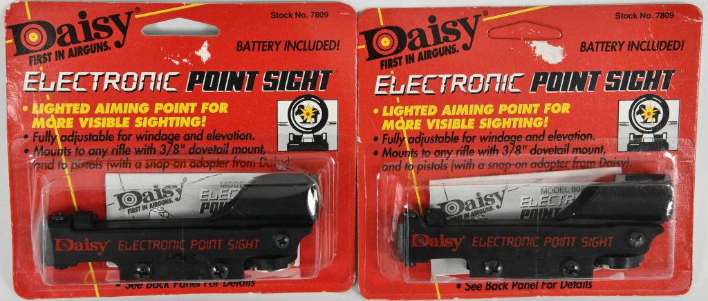 (2) Daisy Electronic Point Sight NIP (battery inc): Lot contains two new in the package Daisy Electronic Point Sight which is fully adjustable for windage and elevation, mounts to any rifle with 3/8" dovetail mount, and to pistols (with a snap on adapt