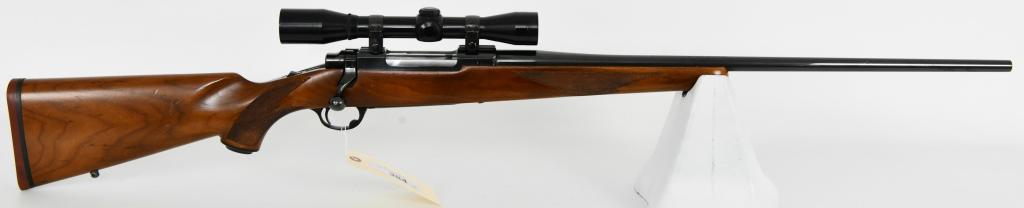 Ruger M77 Rifle 7MM Rem Mag Tang Safety: Up next is a Nice Ruger M77 Bolt Action Rifle Chambered in 7MM Rem Mag. With Early Tang Safety. This great hunting rifle has a 24" barrel, Topped With a Burris 4X Scope, Solid wood stock. Overall in g