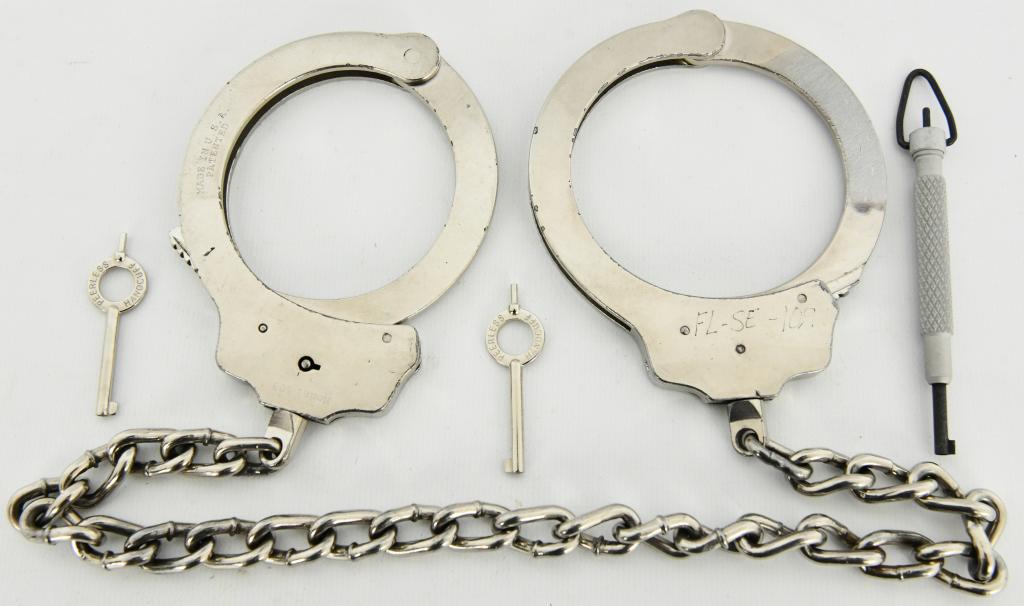 Peerless Model 703 - Leg Iron - Nickel Finish: with two peerless keys and one ZT11 Aluminum swivel key - come to you in real nice pre owned condition, Heavy duty and rugged shackles