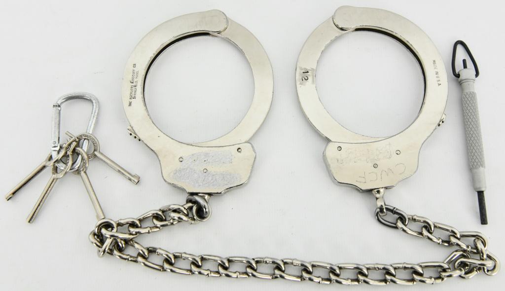 Peerless Model 703 - Leg Iron - Nickel Finish: with two peerless keys and one ZT11 Aluminum swivel key - come to you in real nice pre owned condition, Heavy duty and rugged shackles