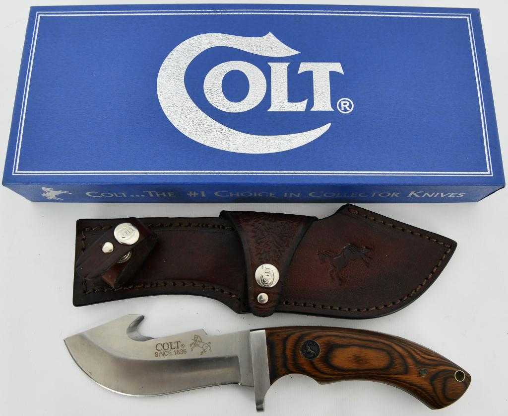 Colt Serengeti Skinner Fixed Blade Knife: Up Next We Have a Colt Serengeti Skinner Fixed Blade Knife, 10" overall. 4 3/4" stainless guthook blade. Pakkawood handles. Full tang. Stainless finger guard. Colt inlay shield. Lanyard hole. Embossed