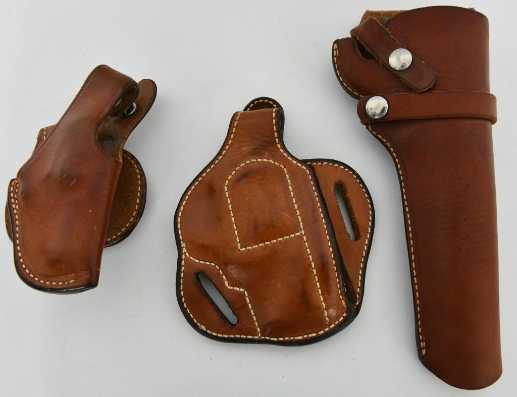 Lot of Three Leather Holsters various sizes: Lot contains one Bianchi Tan Leather Chief SP #56 Holster right hand, there is one Andrews custom Leather Rugged Heavy Duty Tan holster right hand and finally a real nice Hunter 100 K 60 Right Hand ta