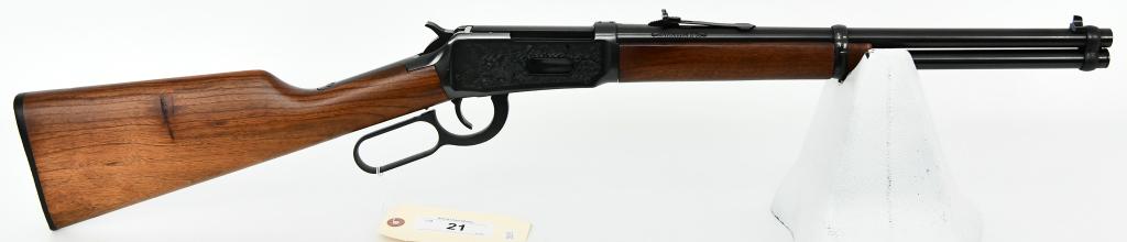 Winchester 94AE Wrangler Saddle Ring .38-55: Up Next We Have an Engraved Winchester 94AE Wrangler Saddle Ring Carbine Chambered in .38-55, 16" Barrel, Appears as New and Unfired. Metal finsh is blue, with engraved wagon train and prospecting sce