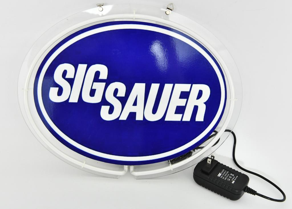 Lighted Neon Sig Sauer Sign: Lighted Neon Sig Sauer Sign, With Power Cord, Measures Approx 14 1/2" x 11 1/2"
