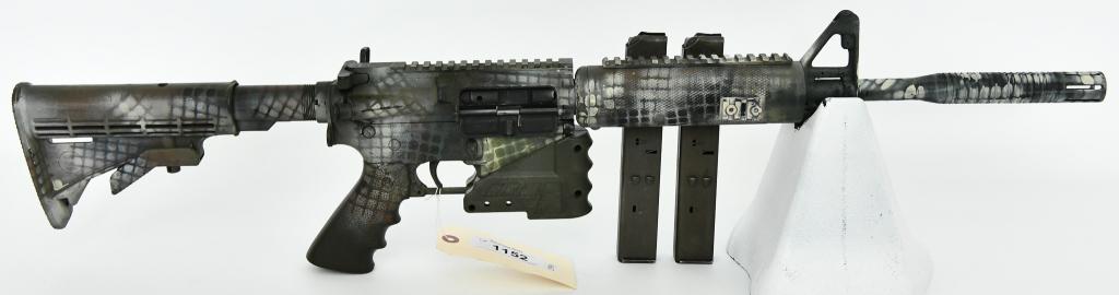 Olympic Arms AR-15 Semi Auto Rifle 9MM: Up Next We Have a Olympic Arms AR-15 Semi Auto Rifle Chambered in 9MM, and Comes In a Camo Print, Equipped With a Tactical Magwell, Oversized Charging Handle, Flash Hider, and Two Magazines. I believe