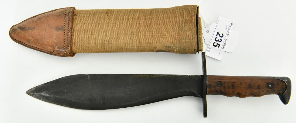 US Mod 1917 Bolo Knife / Machete and Sheath: WWI AEF US Army M1910 Bolo Knife w/Canvas Scabbard, the blade is marked U.S. Mod 1917, Plumb PHIL (there is a number below this marking I can't quite see it) overall length is 15" with the blade appro