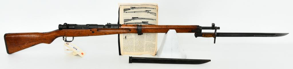 Arisaka Type 99 Toyo Kogyo With Bayonet 7.7: Up Next We Have a Arisaka Type 99 Bolt Action Rifle, Ground Mum, Toyo Kogyo Arsenal Marking Manufactured From 1939-1945. Equipped With a Bayonet and Sheath.