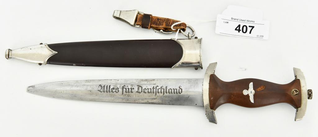 M1933 SA Dagger by RZM M7/1 and Scabbard: SA Dagger by RZM M7/1 (Gebruder Christians, Christianswerk, Solingen). M-1933, made in 1934-1937. Overall length is approx 13.5" with a blade that is approx 8.5" (note: tip is broke off), the handle h
