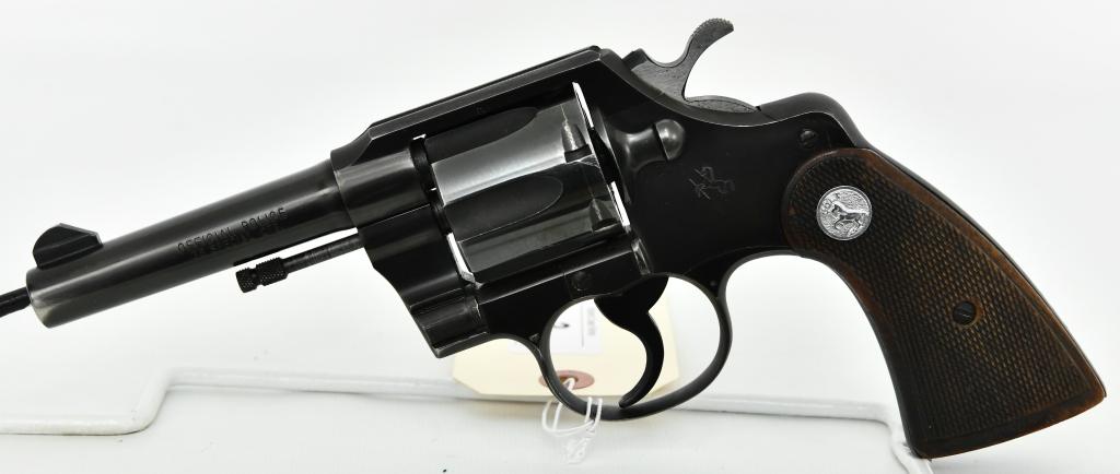 Clean Colt Official Police Revolver .38 Special: Here We Have a Clean Colt Official Police Revolver Chambered in .38, 4" Barrel, Checkered Wood Grips, Serial #826023 and Dates to 1953. Serrated Trigger and Hammer, Overall in Excellent Condition.