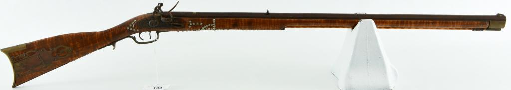 Unmarked Flintlock Full Stock Kentucky Rifle: Up Next We Have a Studded Unmarked Flintlock Full Stock Kentucky Rifle, I Believe Chambered in .45 Caliber, Set Trigger With Brass Hardware and patch box. Overall in Good Condition, Small Split in Woo