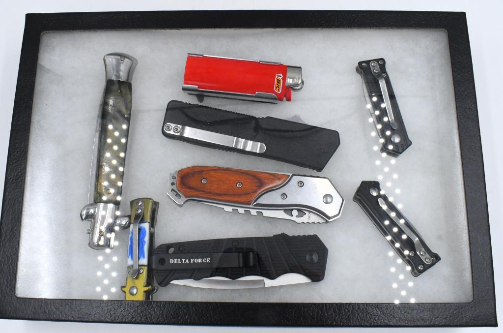 8 Automatic Push Button Pocket Knives: 8 Automatic Push Button Pocket Knives, 1 Delta Force & 1 Mini Joker Knife, 1 Lighter & Knife Combo, Also Comes With 12" x 8" Display Case , All Knives Appear In Overall Good Condition