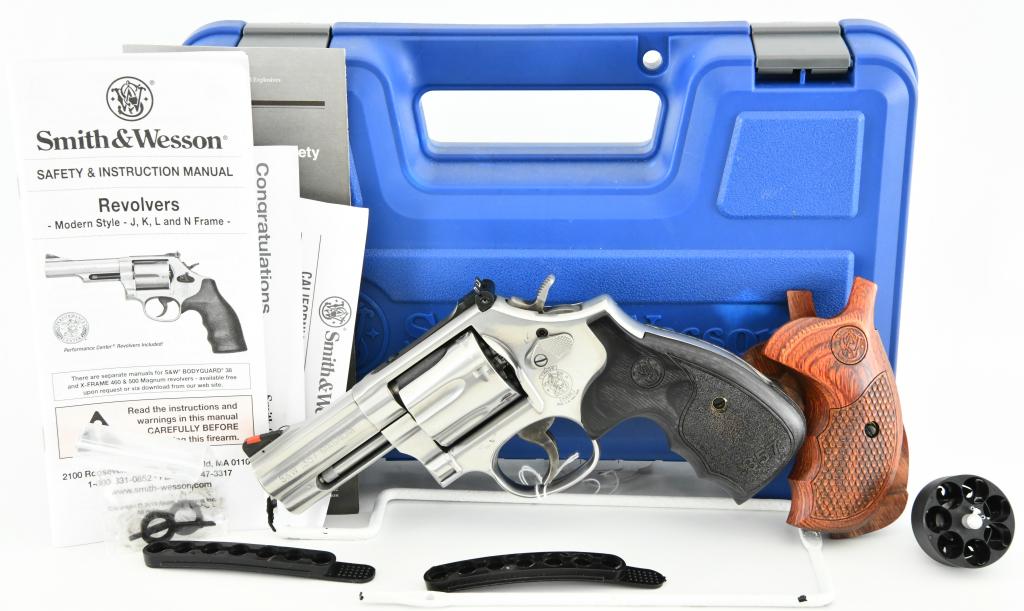 Smith & Wesson Model 686-6 Plus Deluxe .357 Magnum: Up Next We Have a Nice Stainless Smith & Wesson Model 686-6 Plus Deluxe Double Action Seven Shot Revolver Chambered in .357 Magnum, 3" Heavy Barrel, Elegant Textured Wood Grips, and Comes With Additio
