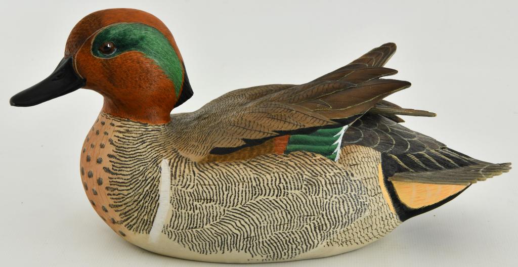 Green Winged Teal Decoy Figurine BY George Kruth: Super nice pre owned Green Winged Teal Decoy Figurine by George Kruth and Danbury Mint. Beautiful life like coloring to this duck figurine, measures approx 10" in length from front of beak to tail fea