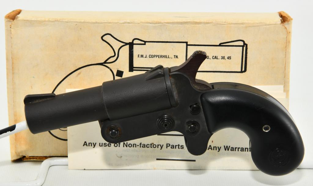 Cobray F.M.J. Model D Derringer .38/.45LC: Up Next We Have a Cobray F.M.J. Model D Derringer Chambered For .38 WCF, .45 Long Colt , and .410 2-1/2 shotshell. 3-3/8-inch barrel, with a excellent bore. Black matte finish is excellent, with some