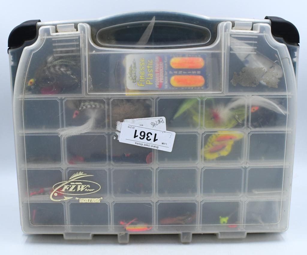 FLW Tour Plastic Fishing Tackle Box W/ Lures: FLW Tour Plastic Fishing Tackle Box W/ Lures, Includes Finesse Plastic Ice Fishing Tails, Jigs , Hooks, & Spoon, Also Comes With Skinning Knife , Has Large Storage And Dividers Inside Box