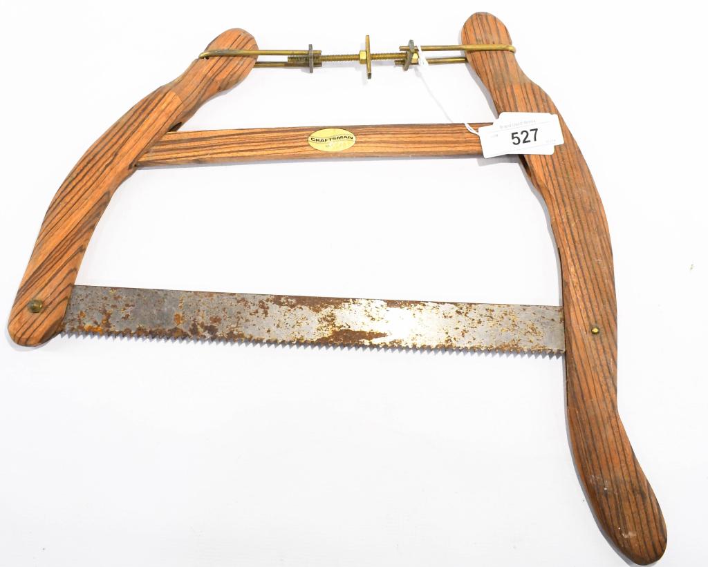Vtg Craftsman hand held wood bow Saw: Vintage Craftsman Hand held wood bow saw. appears to be adjustable, rugged blade appears could be sharp teeth, measures approx 18"x18" in size, interesting tool