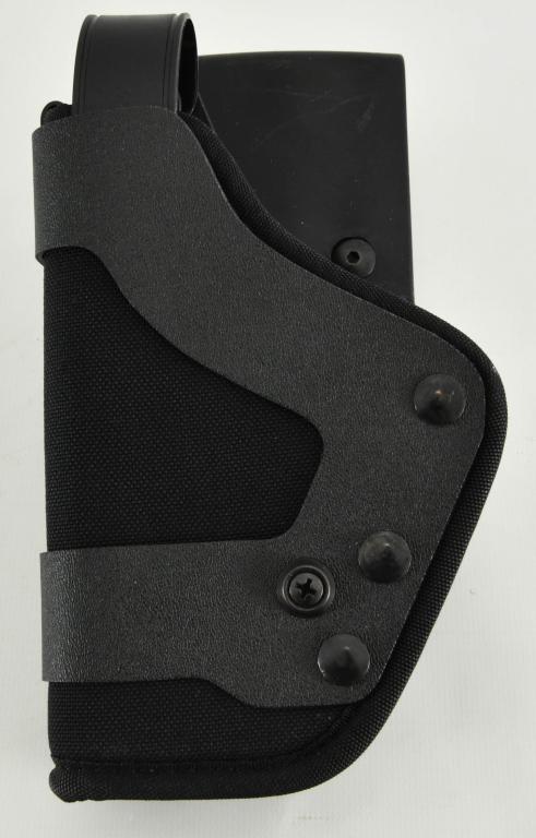 New Uncle Mikes Size 22 Left Handed Holster: New Uncle Mikes Size 22 Left Handed Holster, Black Nylon Material With Plastic Belt Loop, triple Retention Pro 3 Fits Sig 9mm, 45 ACP, & .40 S&W Comes Brand New