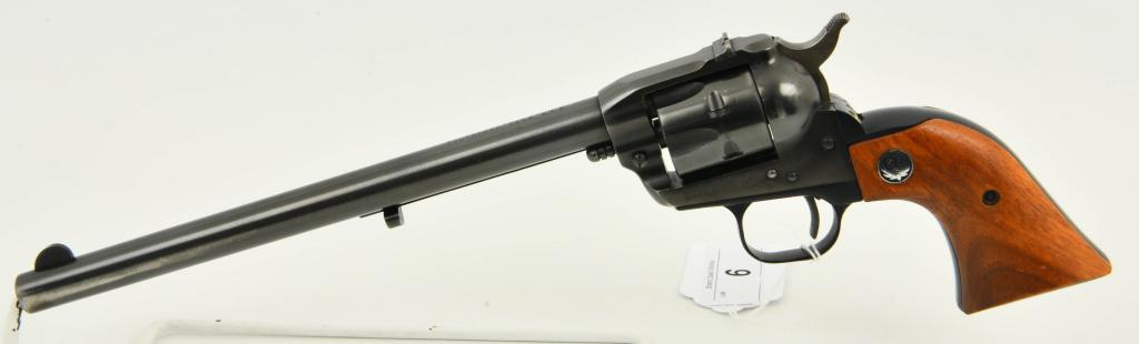 Ruger Old Model Single Six Revolver .22 Cal: Here we have a Ruger Old Model Single Six Revolver Chambered for .22 Caliber With a 9 1/2" Barrel, Original Smooth Wood Grips, Serial # 21-26029. Overall Appears in Excellent Pre-owned Condition.