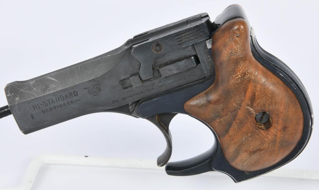 Hi-Standard DM-101 Derringer .22 Magnum 2-Shot: Here we have a nice pocket pistol, This Hi Standard Derringer Model DM-101 Is chambered in .22 WMR and Appears in Excellent pre-owned condition. with the factory wood grips, and the 2 shot over under 